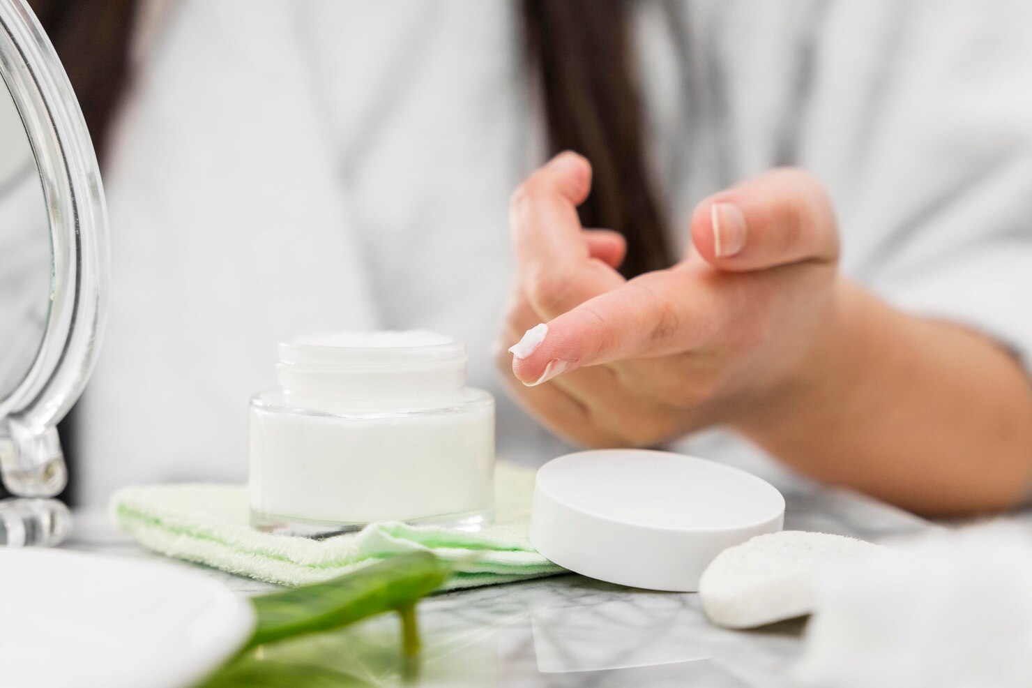 close up hand with cream finger 23 2148708043